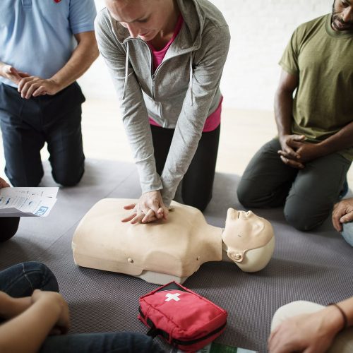 Group of diverse people in cpr training class